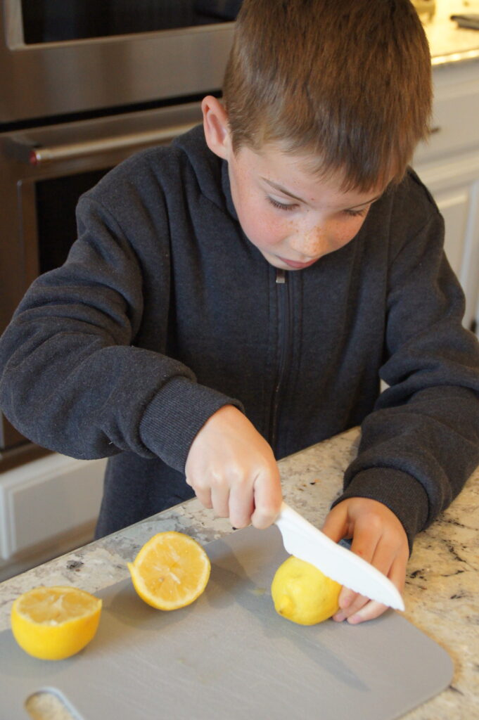 Jack cutting a lemon.